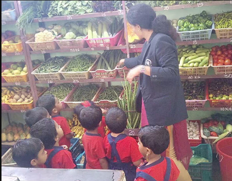 Young learners participating in a vegetable purchasing activity at the market